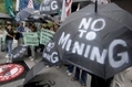  Des manifestants protestent contre l’industrie minière dans la capitale des Philippines,（Stringer: JAY DIRECTO / 2007 AFP）  