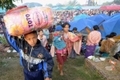 Des milliers de Birmans sont réfugiés dans des camps en Thaïlande pour fuir les combats et les exactions. （Staff: PORNCHAI KITTIWONGSAKUL / 2010 AFP）  