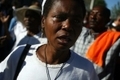 u00ab Pleurs d’une femme en Haïti,  le 12 janvier 2011, un an après le séisme qui a ravagé le pays ». (HECTOR RETAMAL/AFP/Getty Images)（Stringer: HECTOR RETAMAL / 2011 AFP）  