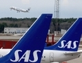 Les avions de la Scandinavian Airline Systems (SAS) à l’aéroport d’Arlanda, en banlieue de Stockholm en Suède. Le récent ultimatum de la SAS à ses employés, une mesure prise pour éviter la faillite, contraste radicalement avec les pratiques commerciales habituelles en Suède. (Pontus Lundahl/AFP/Getty Images)