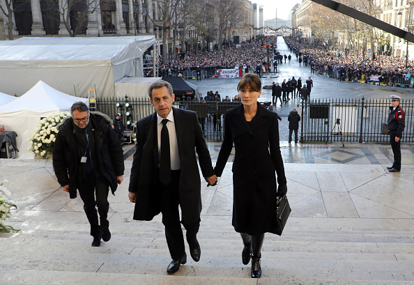 Nicolas Sarkozy et son épouse Carla Bruni, à La Madeleine le 9 décembre 2017. (LUDOVIC MARIN/AFP/Getty Images)