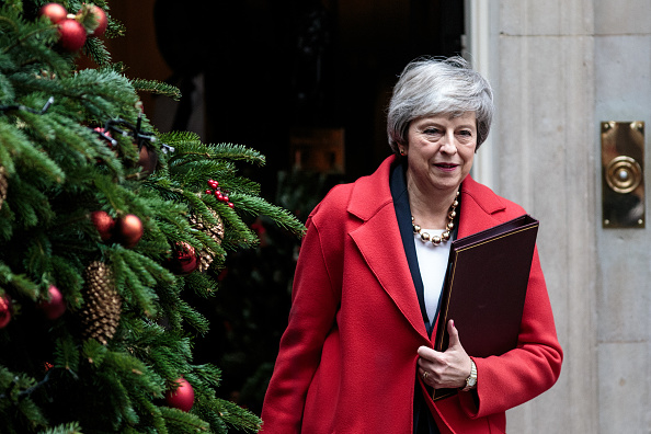 La première ministre britannique Theresa May a multiplié les mises en garde contre les conséquences que pourrait avoir un rejet du traité. "Cela signifierait une grave incertitude pour le pays, avec un risque très réel de ne pas avoir de Brexit, ou de quitter l'Union européenne sans accord", a-t-elle déclaré.  (Photo : Jack Taylor/Getty Images)