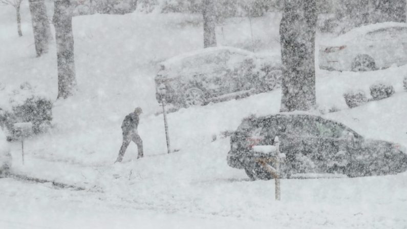 A man walks in snow in a file photo. (Matt Slocum/AP Photo) 