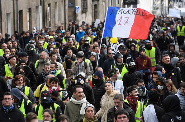 Des Gilets jaunes défilent dans les rues de Nantes le samedi 2 mars 2019. Crédit : FRED TANNEAU/AFP/Getty Images.