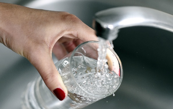 A woman fills up a glass with water on April 27, 2014 in Paris. Eight out of ten people in France say they have ''confidence'' in tap water, according to the water information center's annual barometer, on April 29, 2014. AFP PHOTO / FRANCK FIFE / AFP PHOTO / FRANCK FIFE        (Photo credit should read FRANCK FIFE/AFP/Getty Images)