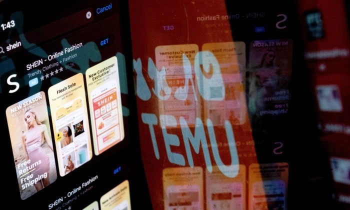 L'application Shein sur l'App Store se reflète dans le logo Temu, à Washington, DC, le 23 février 2023. (Stefani Reynolds/AFP via Getty Images)