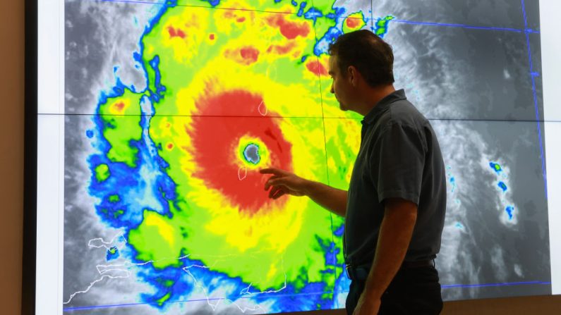 MIAMI, FLORIDA - JULY 01: John Cangialosi, Senior Hurricane Specialist at the National Hurricane Center, inspects a satellite image of Hurricane Beryl, the first hurricane of the 2024 season, at the National Hurricane Center on July 01, 2024 in Miami, Florida. On Monday afternoon, the storm, centered 30 miles west-northwest of Carriacou Island, became the strongest hurricane this early in the season in this area of the Atlantic. (Photo by Joe Raedle/Getty Images)